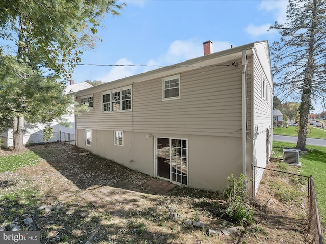 back of property with central AC unit