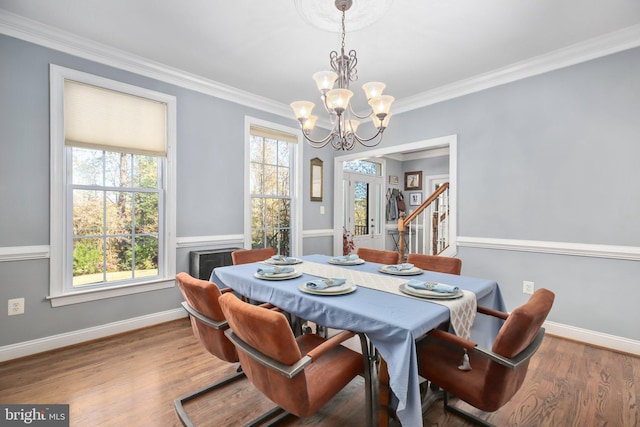 48 Old Creekside Rd, Fredericksburg, VA 22405 - dining room featuring baseboards, wood finished floors, an inviting chandelier, and crown molding