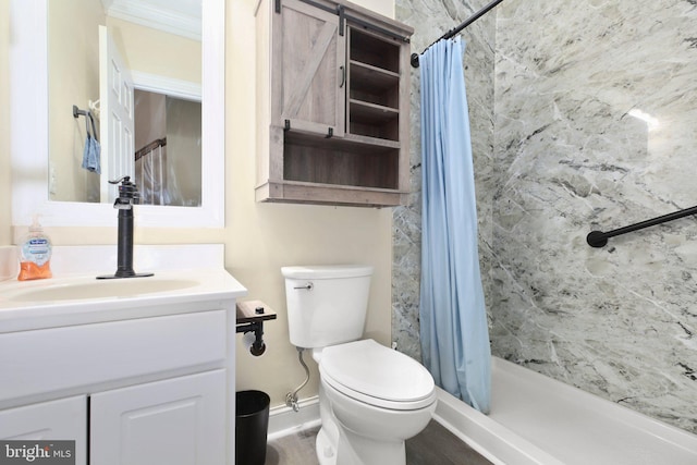 bathroom with vanity, toilet, ornamental molding, and curtained shower