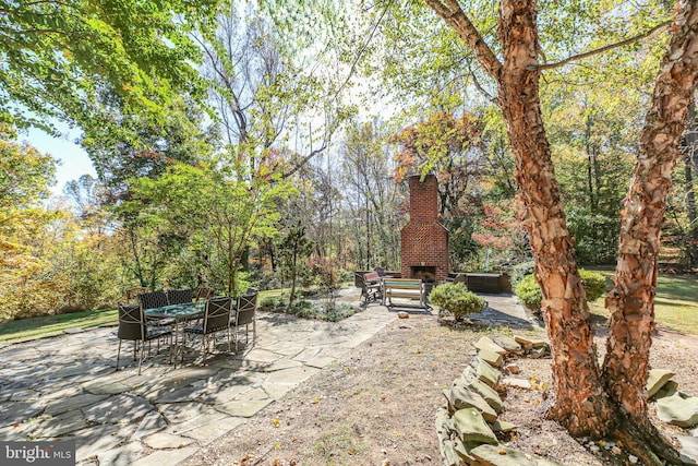 48 Old Creekside Rd, Fredericksburg, VA 22405 - view of patio with an outdoor brick fireplace
