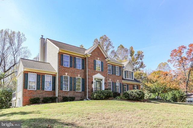 48 Old Creekside Rd, Fredericksburg, VA 22405 - colonial-style house with a chimney, brick siding, and a front lawn