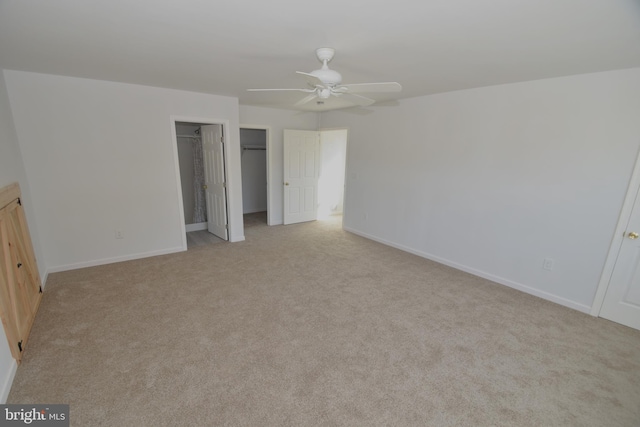 unfurnished bedroom with light colored carpet and ceiling fan