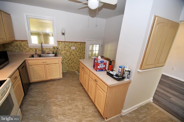 kitchen with ceiling fan, stainless steel appliances, sink, and light brown cabinets