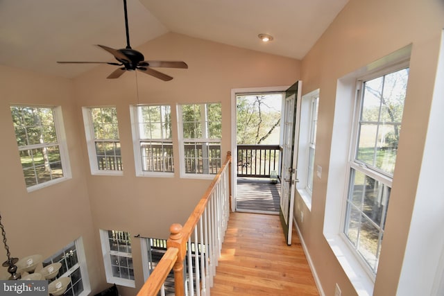 sunroom featuring lofted ceiling and ceiling fan