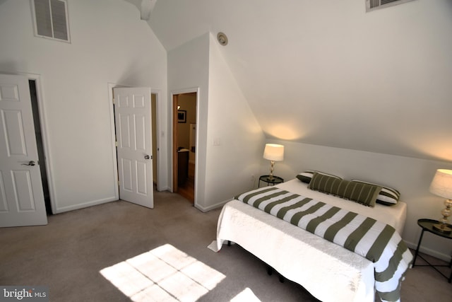 carpeted bedroom with vaulted ceiling