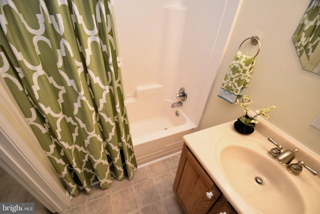 bathroom with vanity, shower / tub combo with curtain, and tile patterned floors