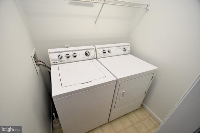 laundry room featuring washer and clothes dryer