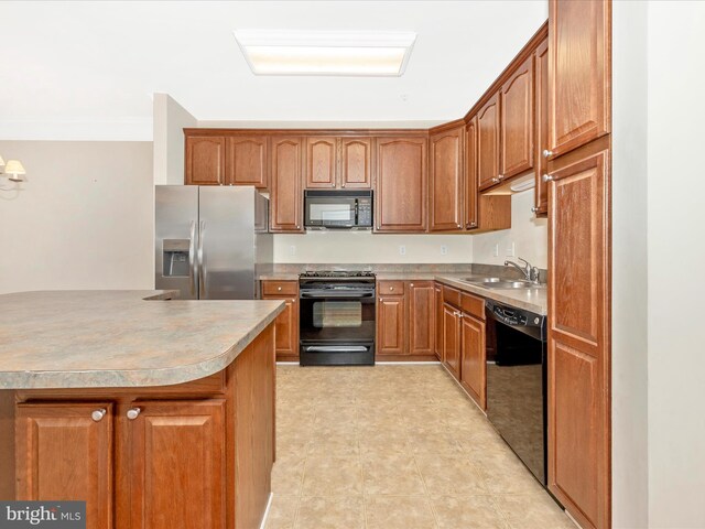 kitchen with sink, black appliances, and crown molding