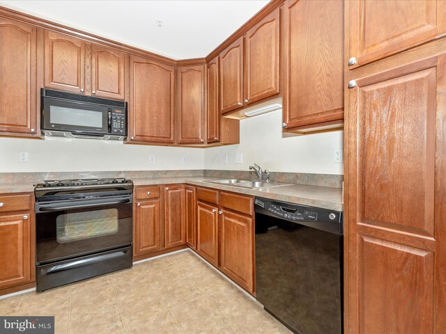 kitchen with black appliances and sink