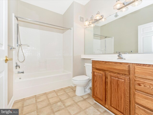 full bathroom featuring vanity, shower / tub combination, and toilet