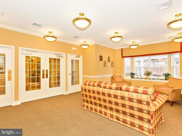 carpeted living room with french doors and ornamental molding