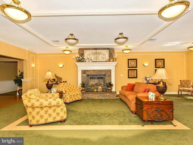 carpeted living room featuring a fireplace and crown molding