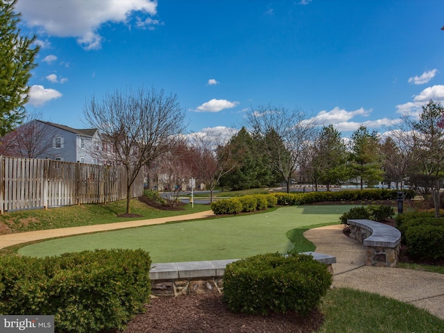 view of home's community with a yard