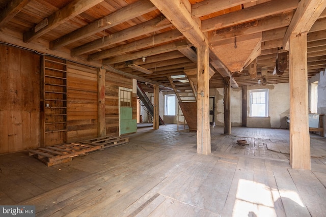 basement with hardwood / wood-style flooring and wood ceiling