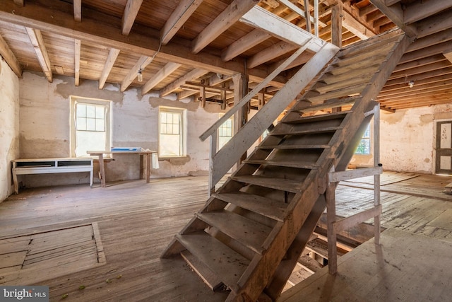 interior space with hardwood / wood-style floors, wooden ceiling, and beamed ceiling