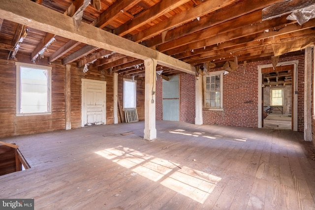 misc room with hardwood / wood-style floors, a wealth of natural light, and wood ceiling