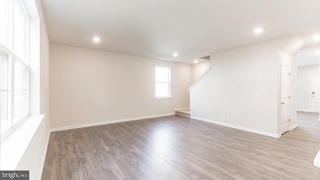 spare room with hardwood / wood-style flooring