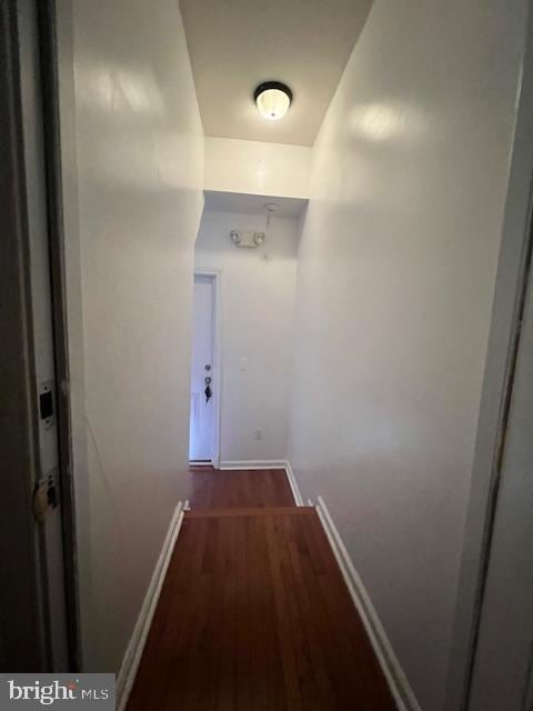 hallway featuring dark wood-type flooring