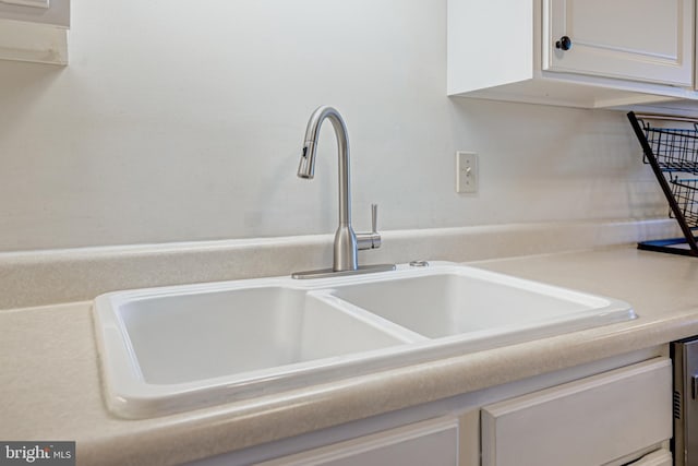 room details with sink and white cabinetry