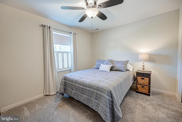 bedroom featuring ceiling fan and light carpet