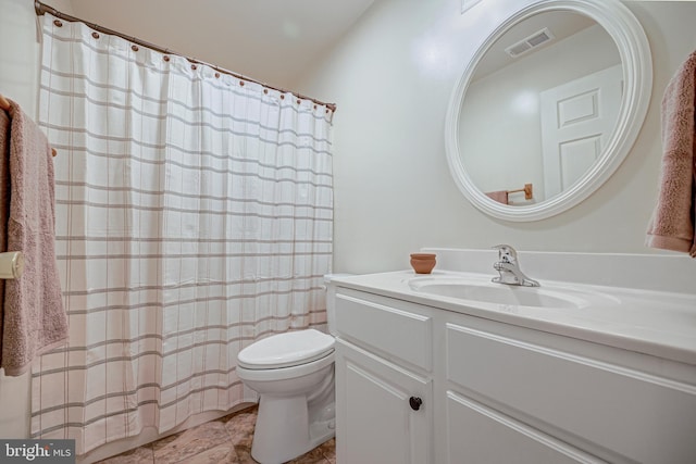 bathroom featuring vanity, a shower with curtain, and toilet