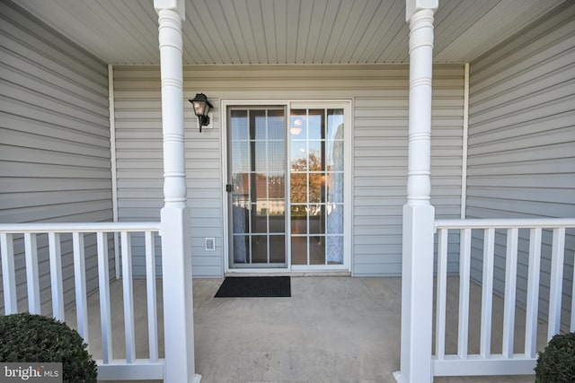 property entrance featuring covered porch