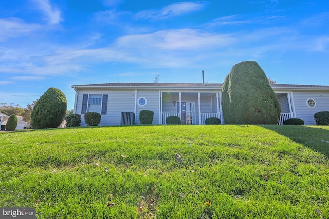 single story home with covered porch and a front lawn