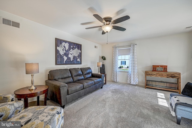 carpeted living room featuring ceiling fan