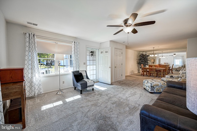 carpeted living room featuring a healthy amount of sunlight and ceiling fan