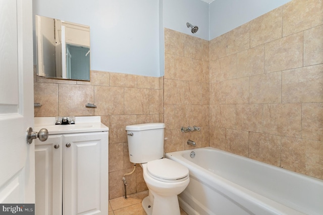 full bathroom with toilet, shower / bath combination, tile walls, vanity, and tile patterned flooring