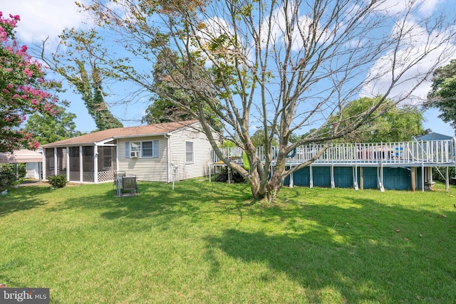 view of yard with a sunroom