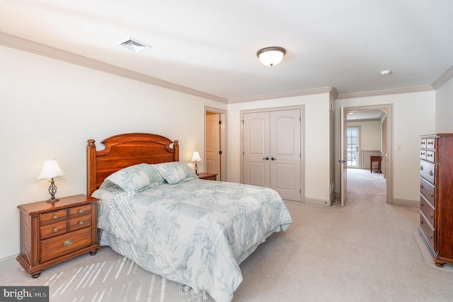 bedroom with visible vents, light carpet, a closet, crown molding, and baseboards