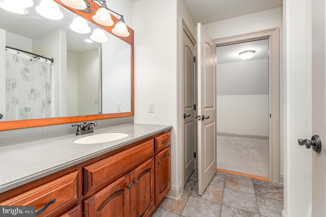 bathroom featuring vanity and baseboards