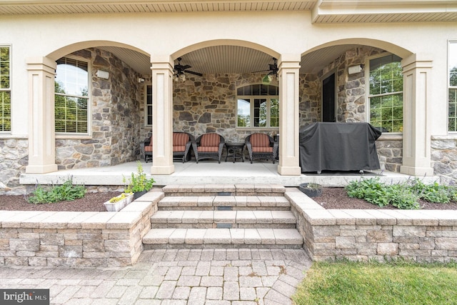 view of patio / terrace featuring area for grilling, a ceiling fan, and covered porch