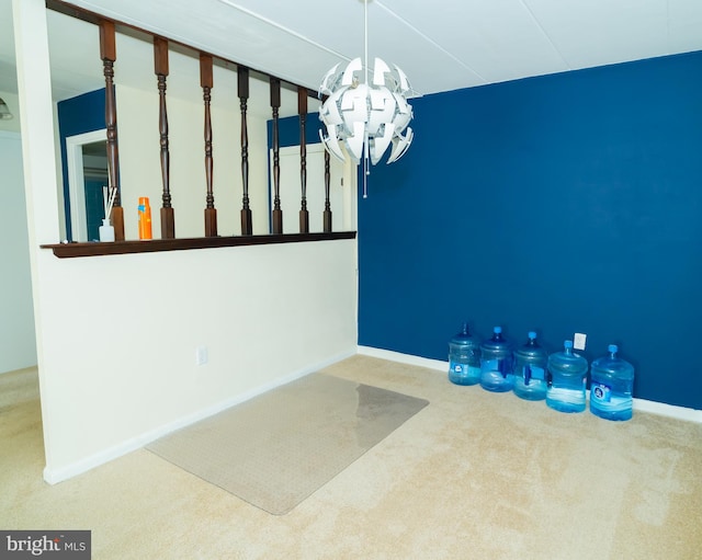 unfurnished dining area with carpet flooring and a chandelier