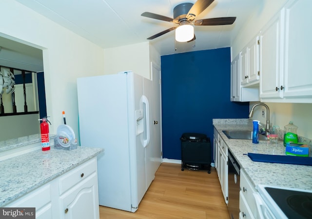 kitchen with white appliances, light hardwood / wood-style flooring, sink, and white cabinets