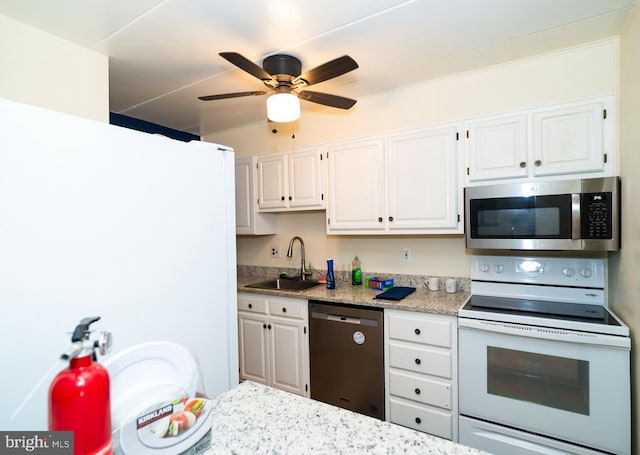 kitchen with sink, white cabinetry, stainless steel appliances, and ceiling fan