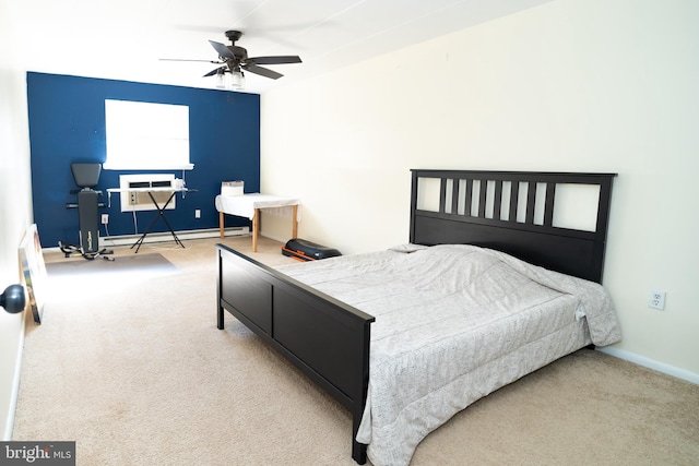 bedroom with light carpet, a baseboard radiator, and ceiling fan