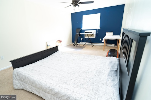 bedroom with carpet floors, baseboard heating, and ceiling fan