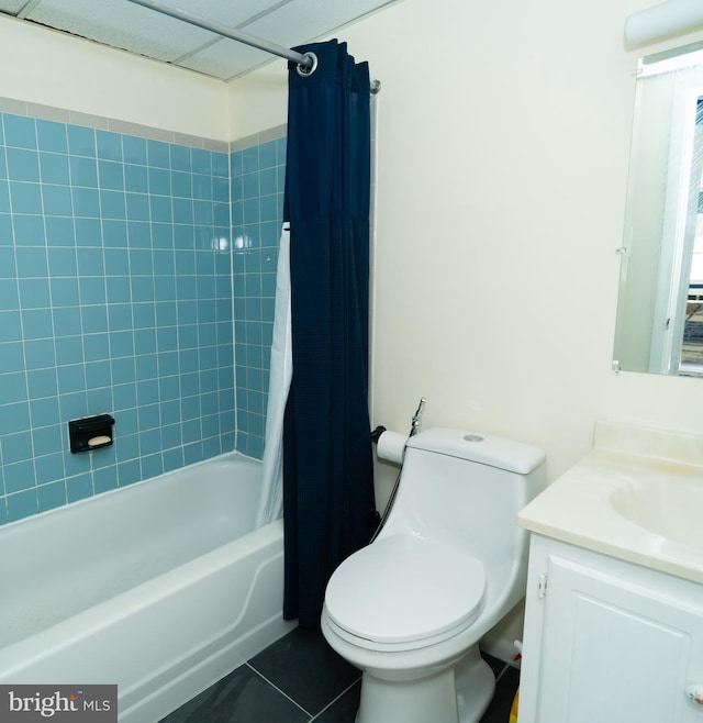 full bathroom featuring toilet, tile patterned flooring, vanity, and shower / tub combo