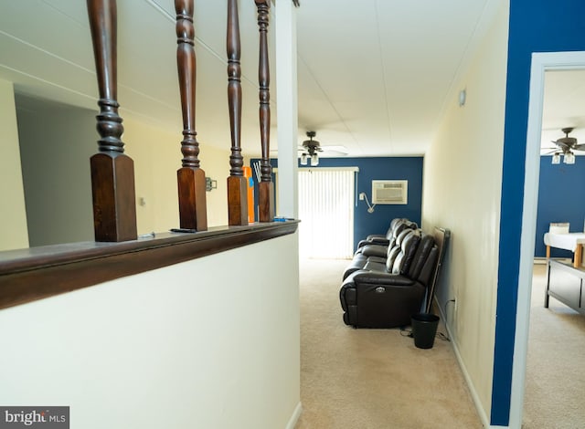 hall featuring a wall mounted AC and light colored carpet