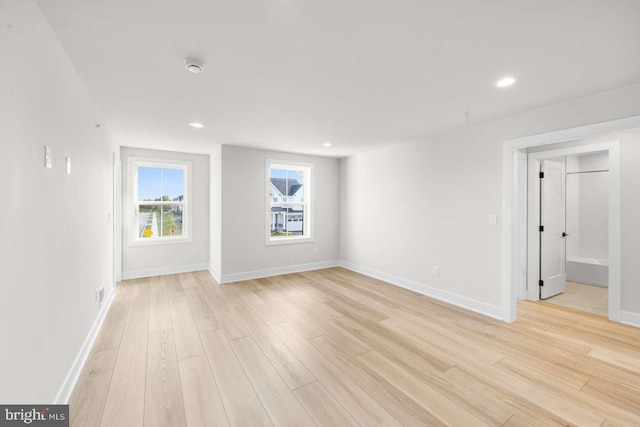 spare room featuring light wood-type flooring