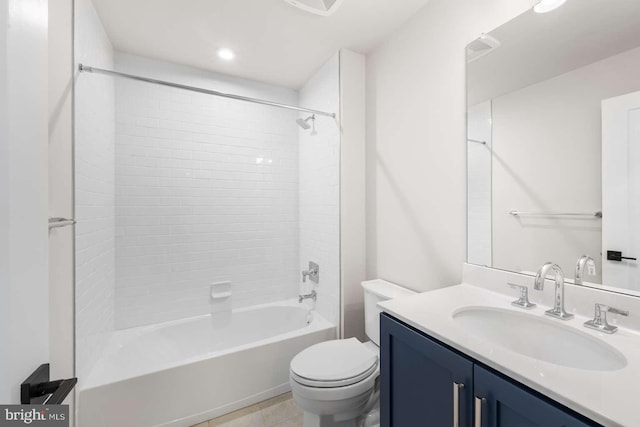 full bathroom with vanity, toilet, tile patterned floors, and tiled shower / bath