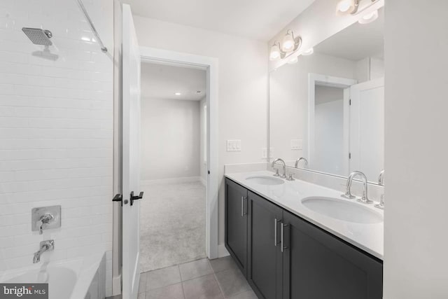 bathroom featuring vanity, tile patterned floors, and tiled shower / bath