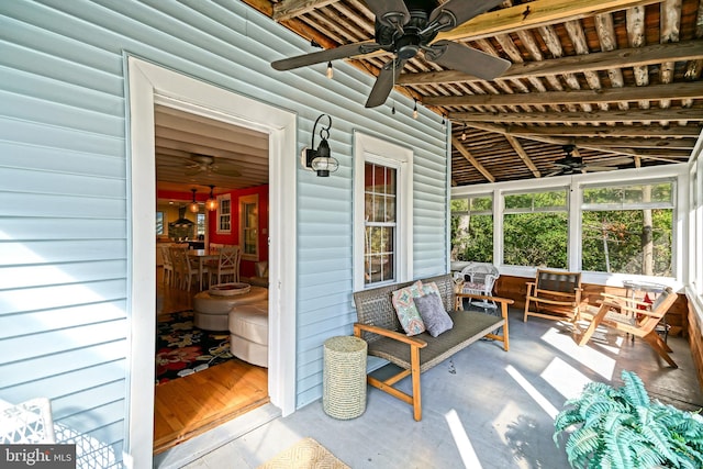 sunroom / solarium featuring vaulted ceiling