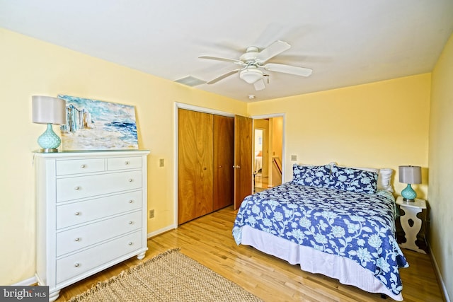 bedroom featuring a closet, ceiling fan, and light hardwood / wood-style flooring