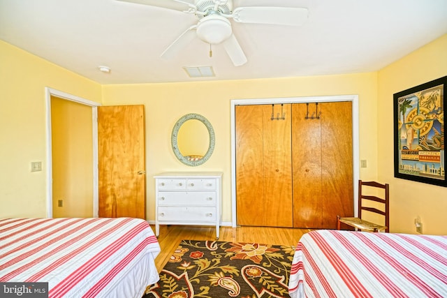 bedroom featuring a closet, ceiling fan, and hardwood / wood-style floors