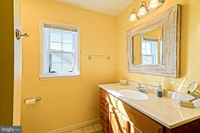 bathroom featuring vanity, tile patterned flooring, and plenty of natural light