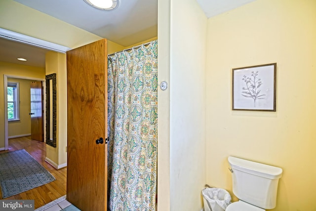 bathroom featuring toilet and hardwood / wood-style floors