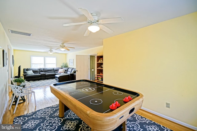 game room featuring hardwood / wood-style floors and ceiling fan